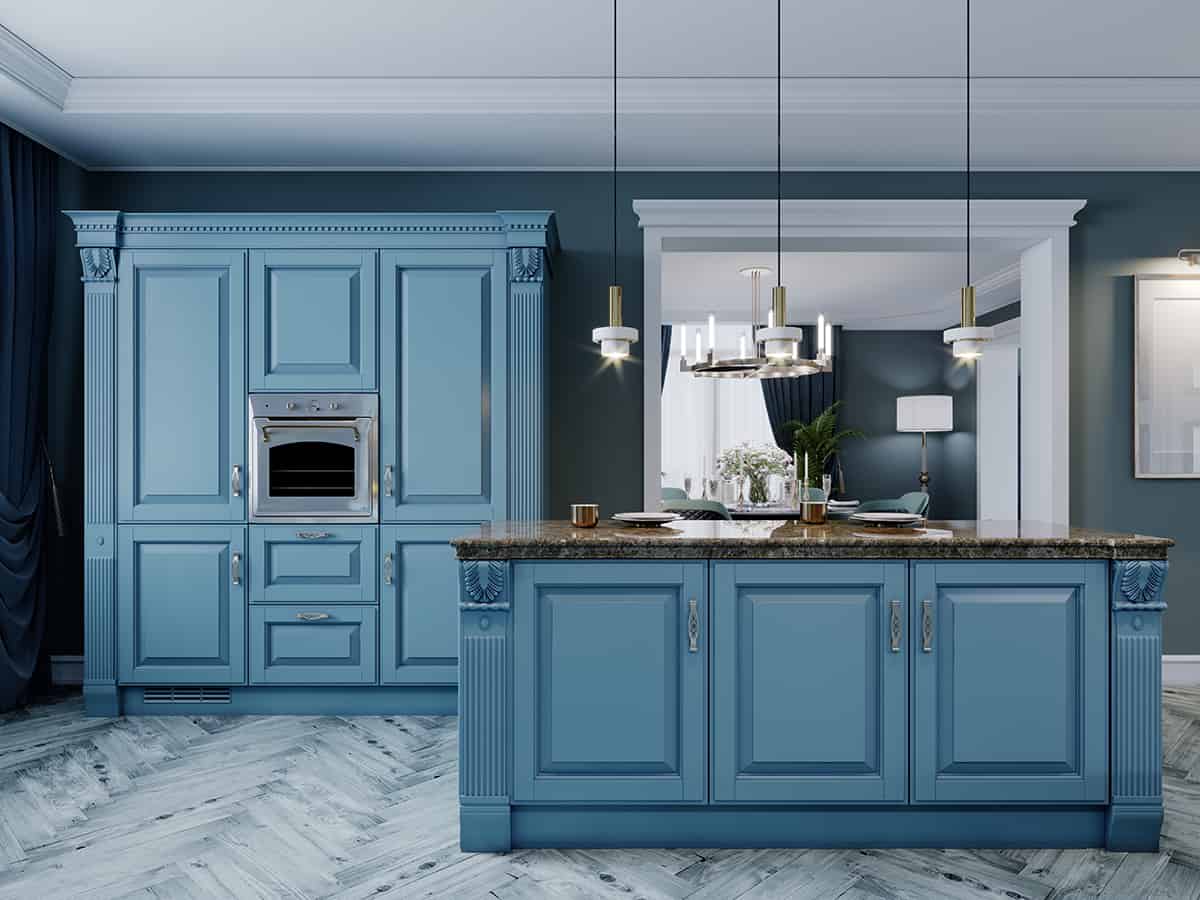 Blue kitchen cabinets and gray floors