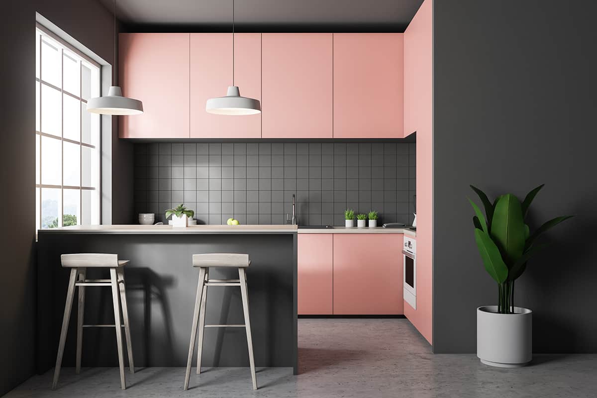 Pink kitchen cabinets and gray floors