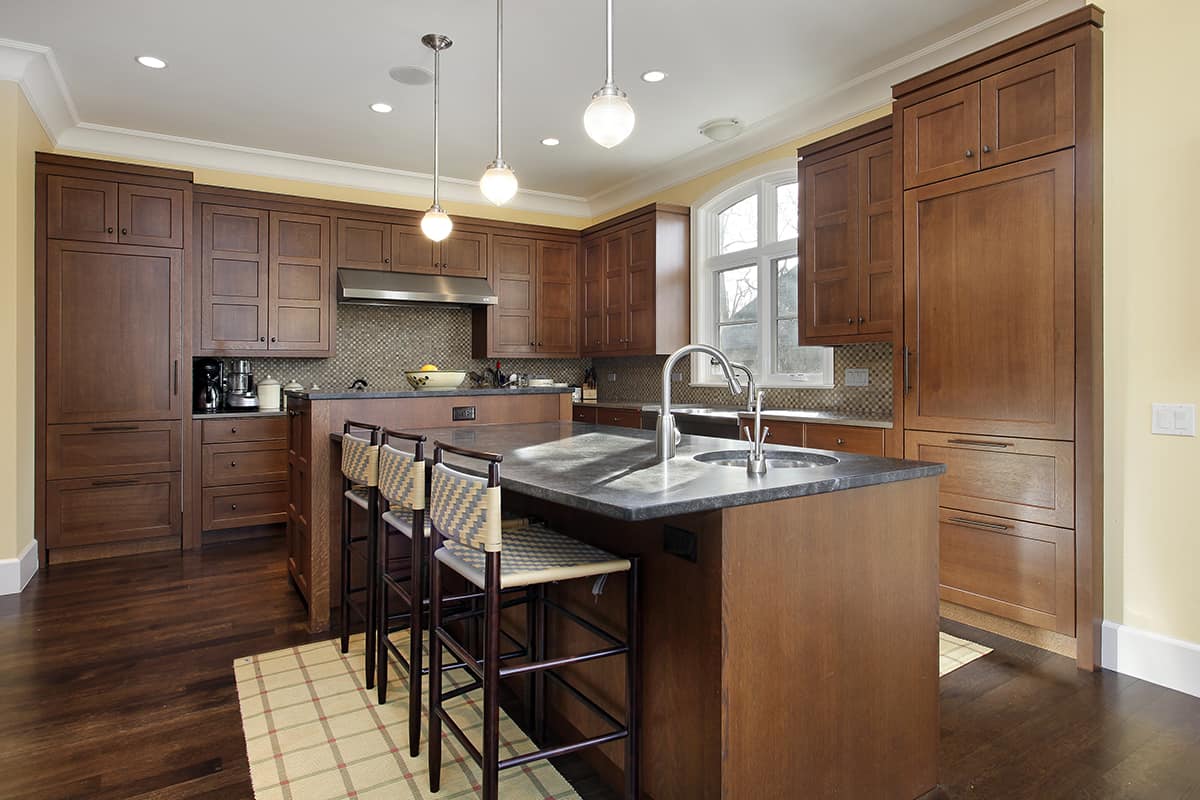 Brown floors and oak cabinets