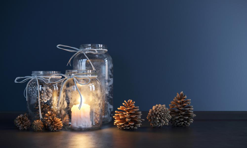 Mason jars with pinecones and candles thanksgiving table ideas