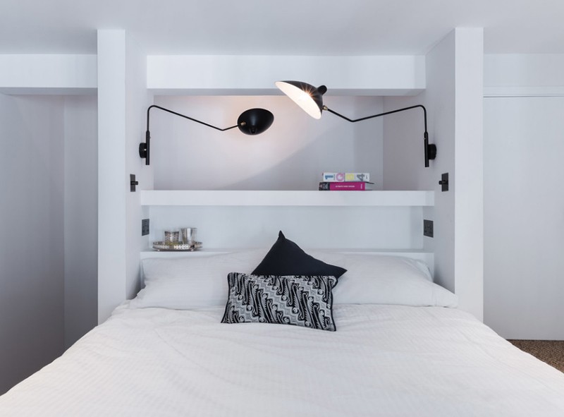 White Bed with black and white lamps over the bed
