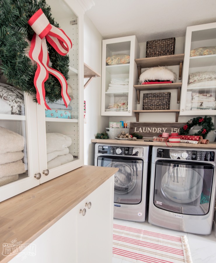 Christmas Laundry Room with Red Striped Rug via thediymommy